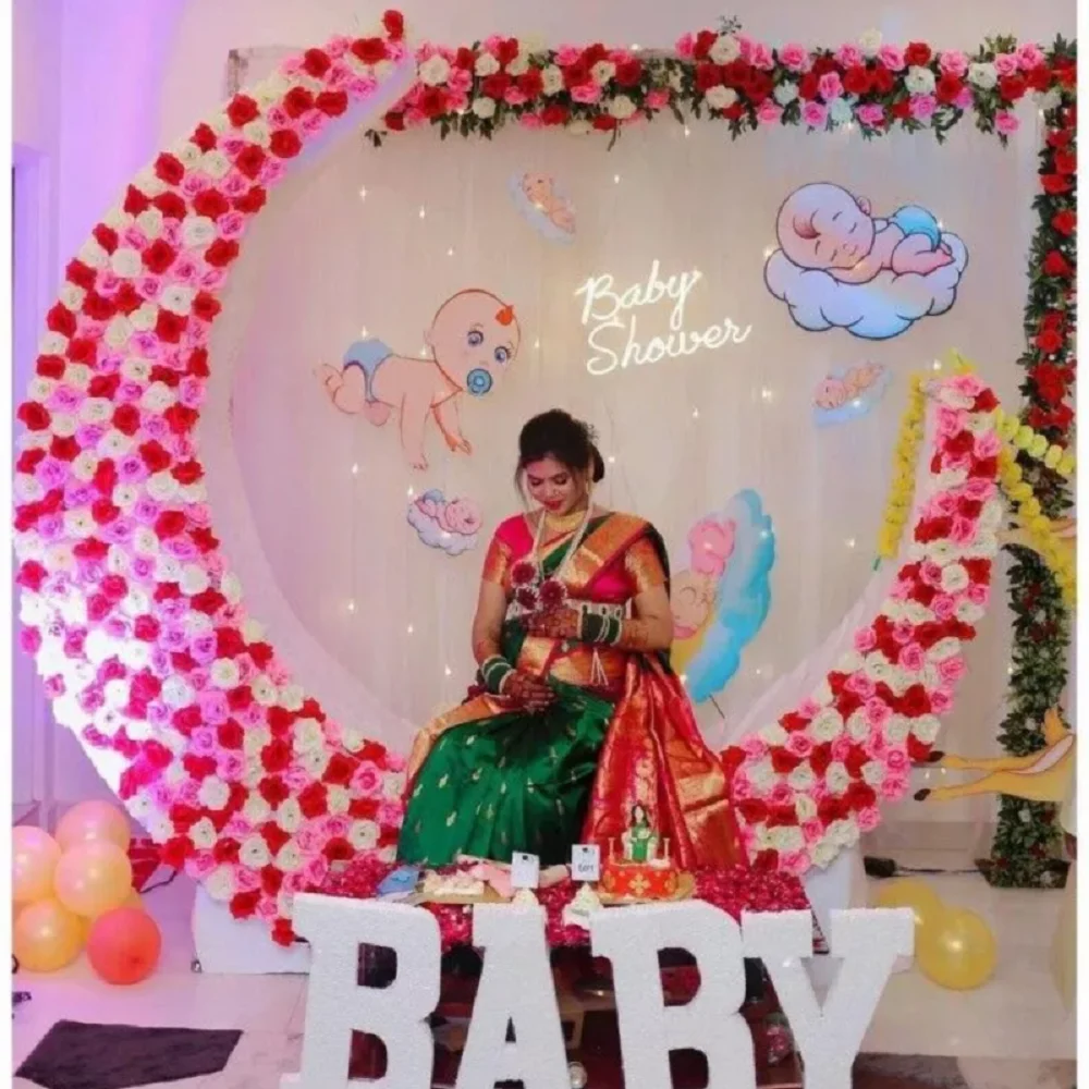 Professional baby shower decoration service showcasing customized balloons, floral designs, photo backdrop, and elegant party styling.